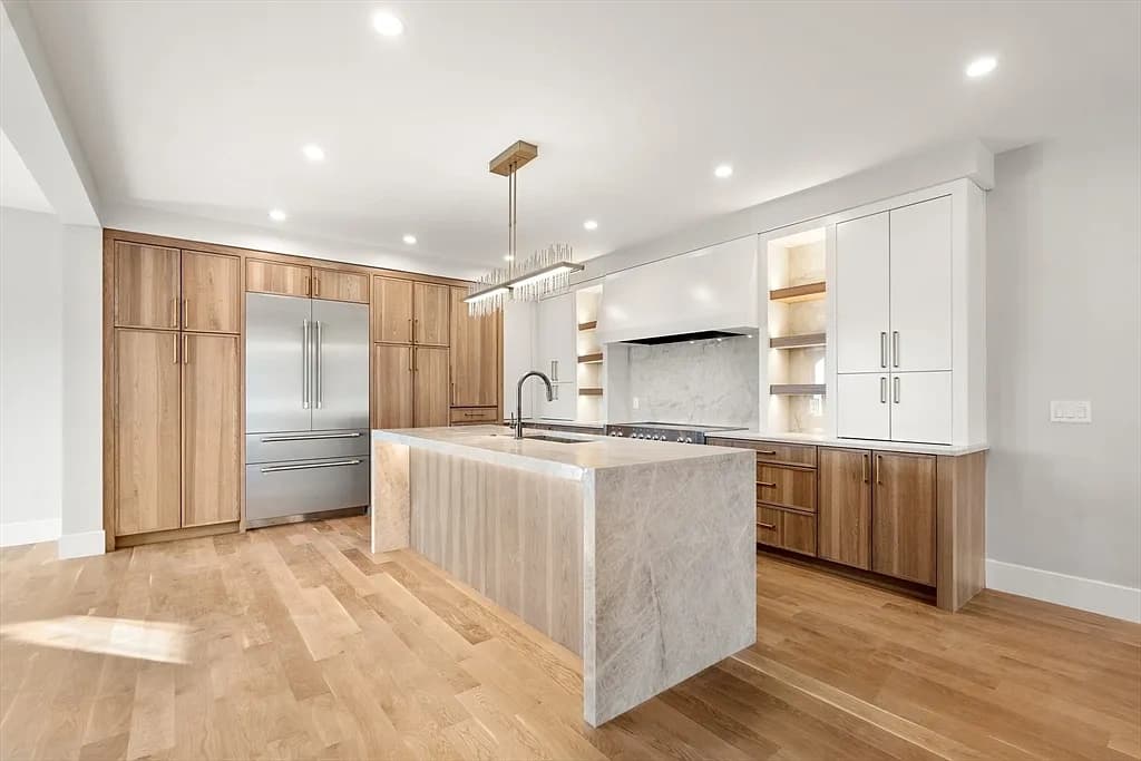 Quartzite island with mitered edge and porcelain backsplash — Newton, MA
