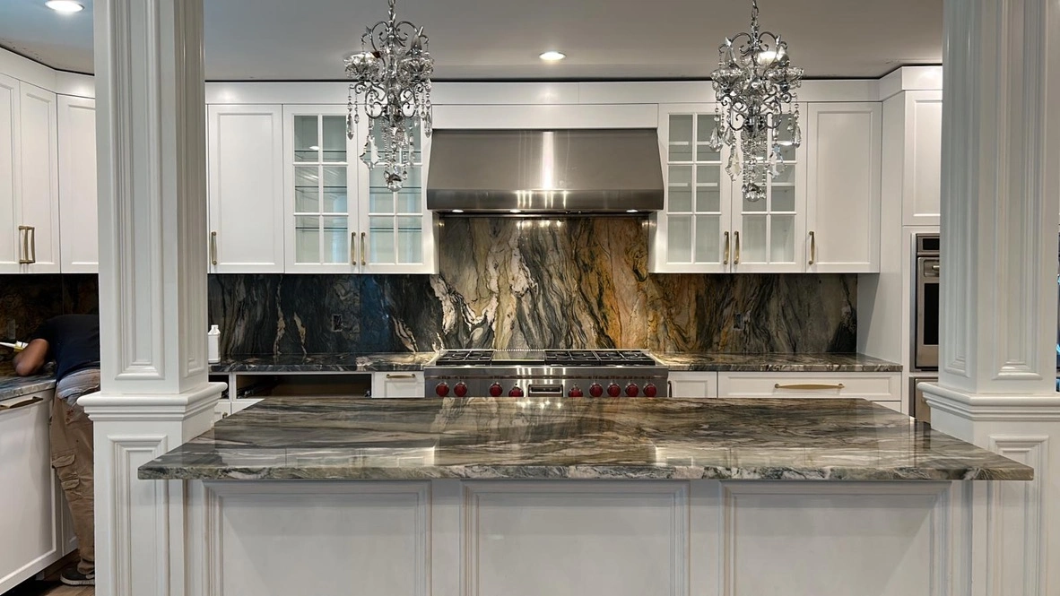 Luxury kitchen with quartzite island and backsplash in West Newton