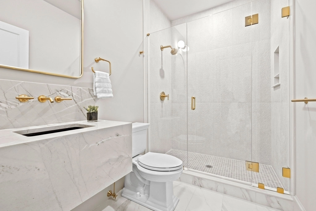 White quartz vanity with wall faucets and apron - Lexington, MA